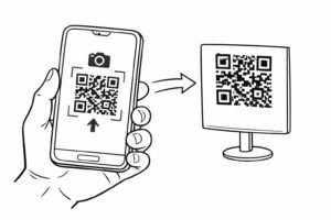 Smartfon trzymany w dłoni skanujący kod QR